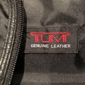 Tumi leather & nylon bifold garment bag.